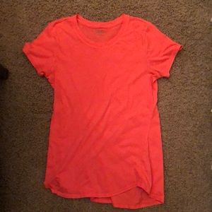 Hot orange loose t-shirt.
